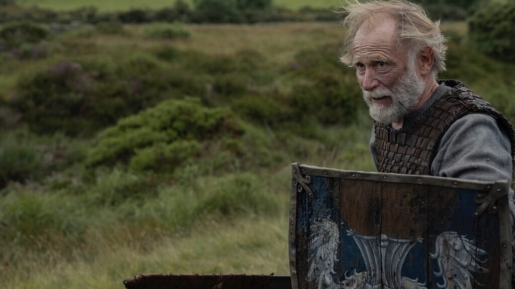 A Knight of the Seven Kingdoms new image from HBO adaptation. Ser Arlan of Pennytree holding a shield in A Knight of the Seven Kingdoms, showing a visual change from the Dunk and Egg book