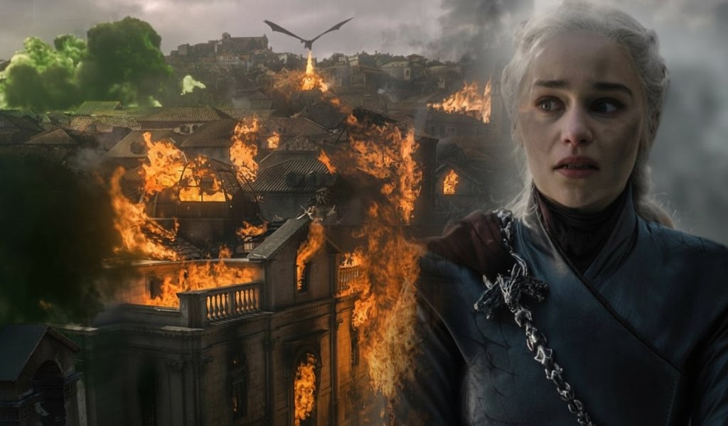 Close-up of a tearful and distressed Daenerys Targaryen with the burning city of Kings Landing and green wildfire explosions in the background.