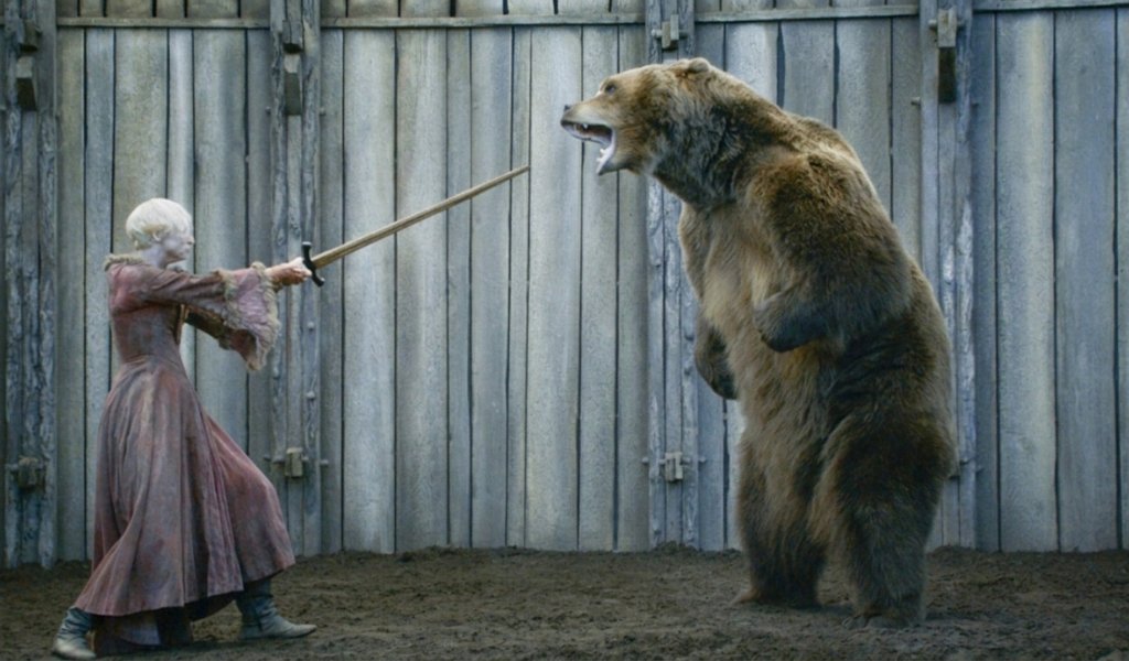 Brienne of Tarth facing a bear in the Harrenhal bear pit in Game of Thrones.