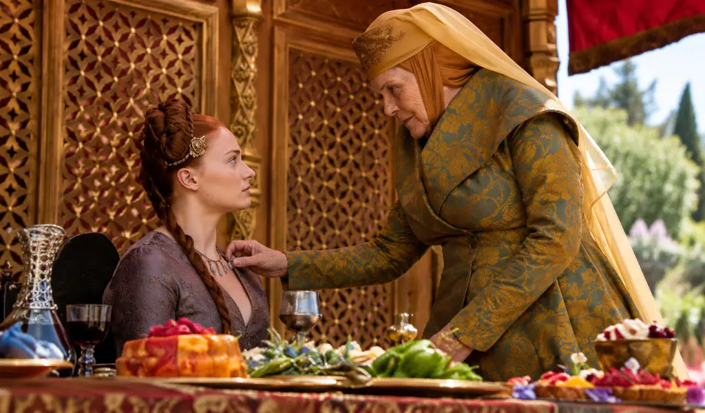Lady Olenna Tyrell taking poisoned stone from Sansa Stark necklace during Purple Wedding